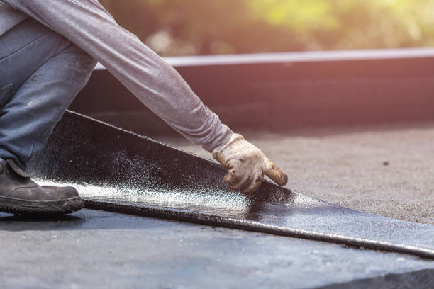 Professional Waterproofing technician working in Fenwick, MI